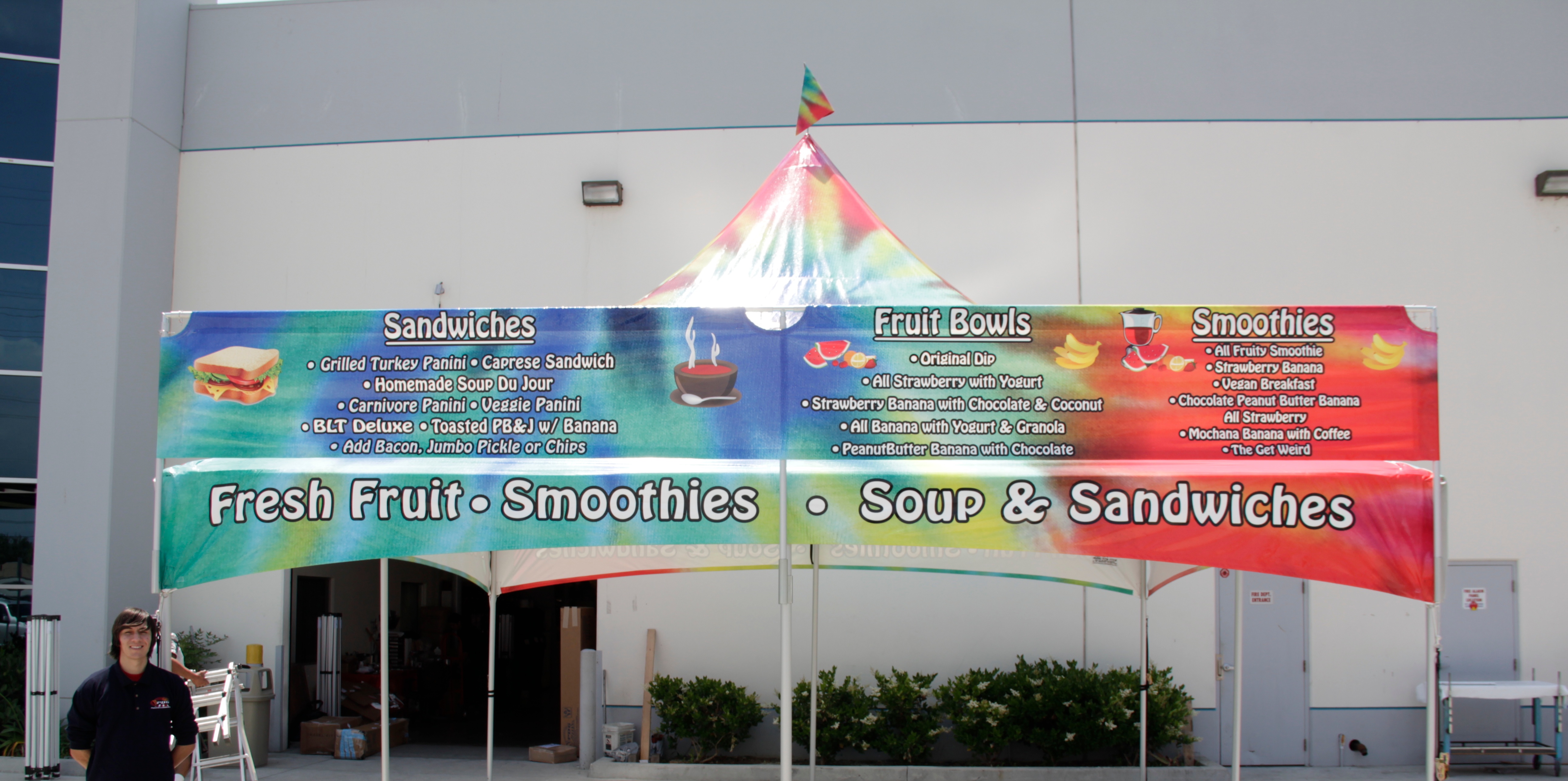 20 foot tent banner used as a menu on top of a high peak tent