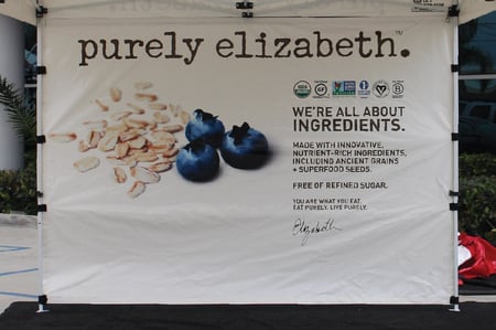 custom printed full back wall with blueberries and seeds of some sort as well as a note talking about quality of the ingredients