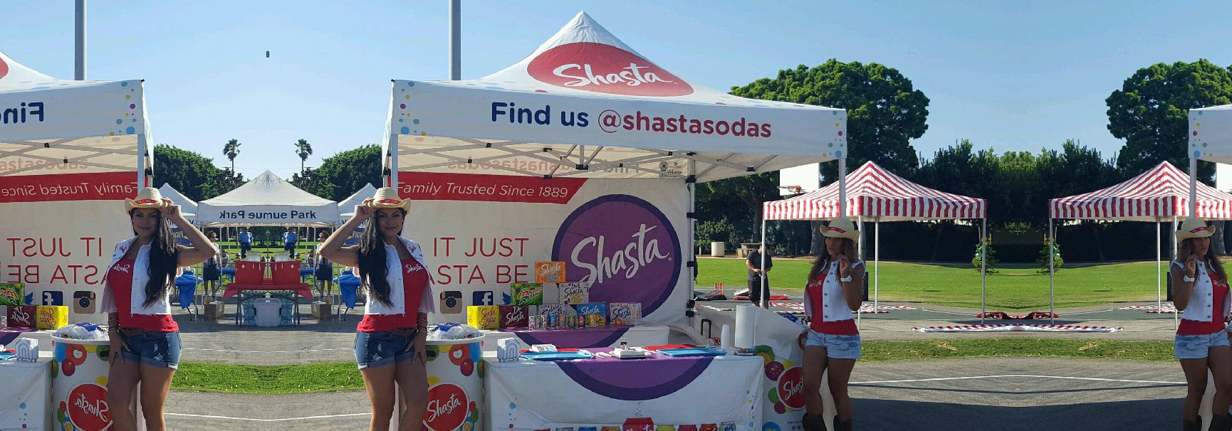 shasta soda gold package custom canopy installed at an event with multiple other canopies