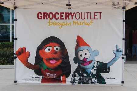 Grocery outlet full back wall with a custom print of puppets on it