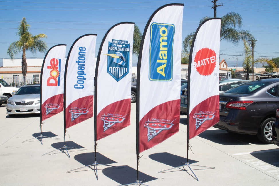 Disney's Cars 3 sponsors  listed on various advertising flags