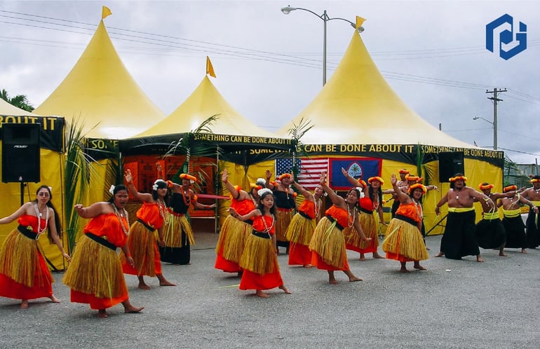 ceremonial-hula-dance-infront-of-three-octagonal-high-peak-tents