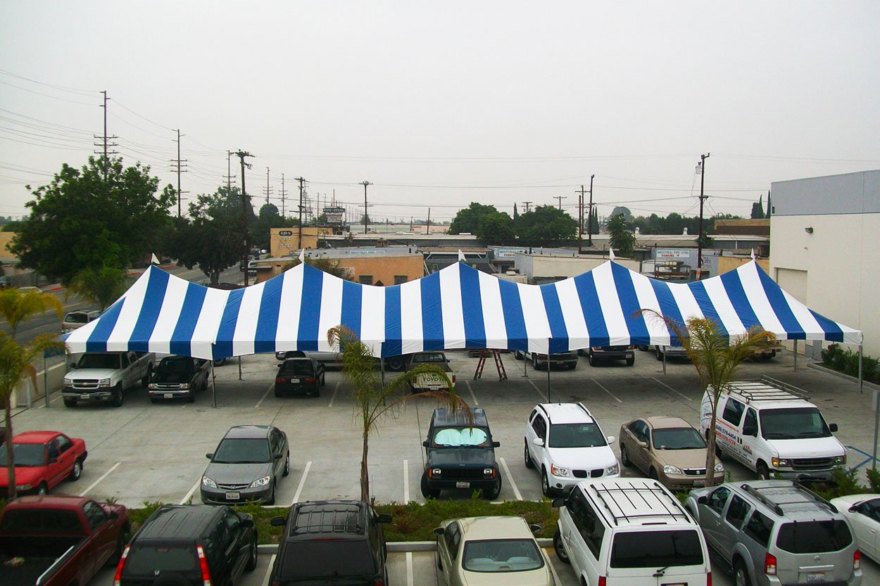 20x100-blue-white-striped-frame-tent-onsite