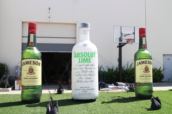inflatable-liquor-bottles-on-faux-grass