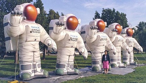 Multiple Inflatable Astronauts with the IMAX logo printed on their chest
