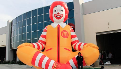 Inflatable 25 foot Ronald McDonald replica sitting outside the promotional design group building