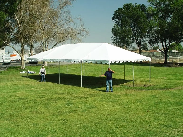 20x40 white frame tent rental set up on grass with open sides for shade and event coverage