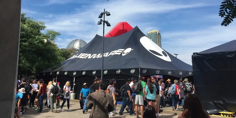 Large branded event tent with Alienware graphics used for a high-traffic brand activation with crowds