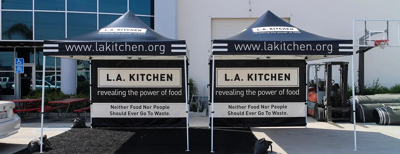 Close-up of canopy valance printing with website URL and clean brand layout for visibility