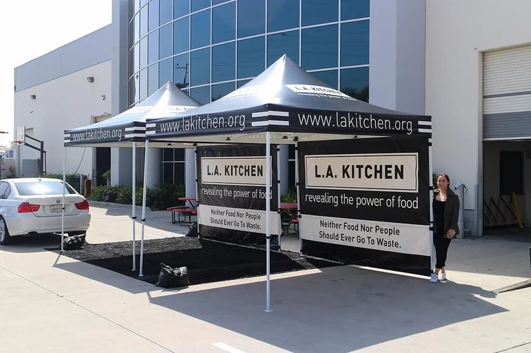 Custom printed pop up canopy tents with L.A. Kitchen branding and full wall graphics