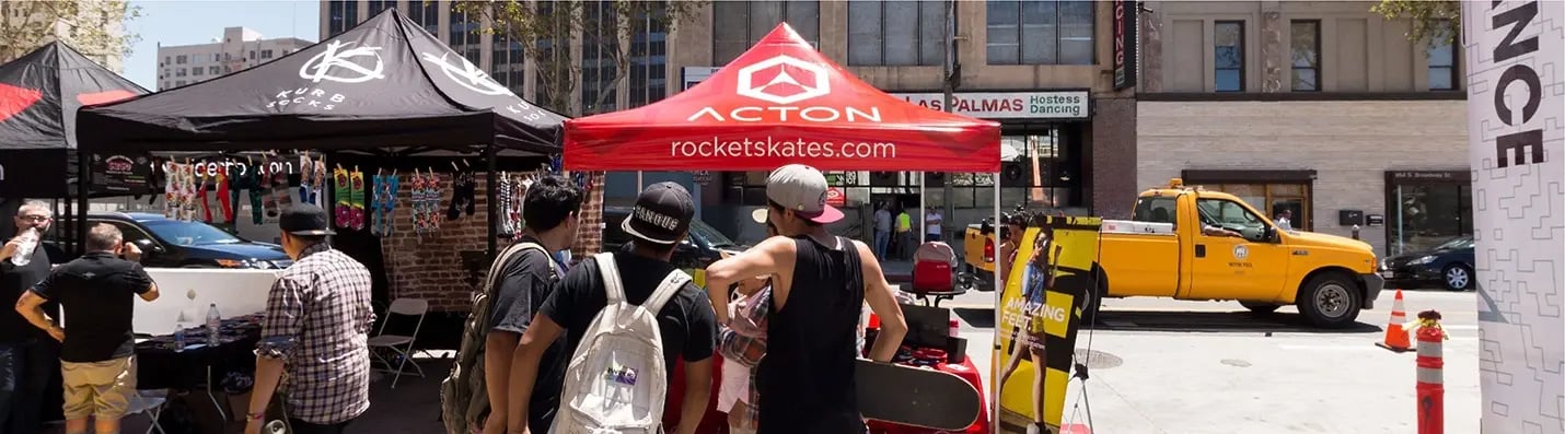 10x10 Acton custom pop up canopy with rocketskates.com branding at an outdoor street event