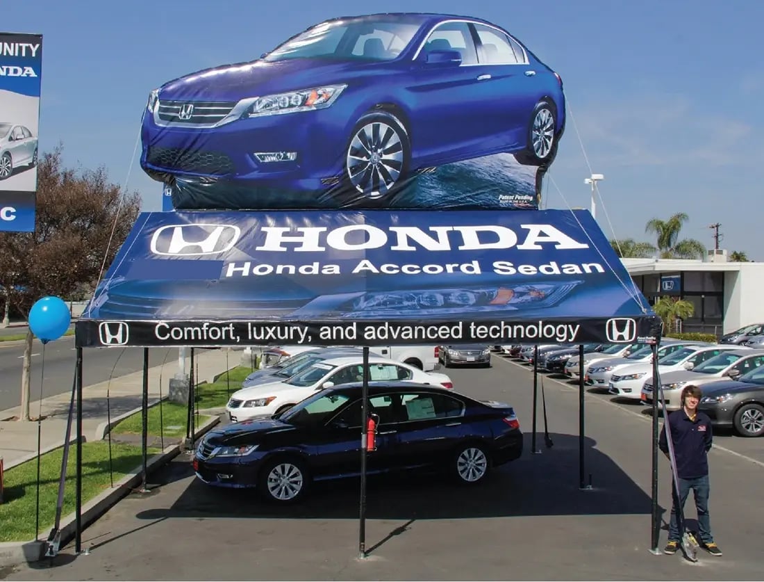 Honda Accord Sedan dealership event display with a custom frame tent featuring Accord graphics and a large car topper Honda Accord Sedan dealership event display with a custom frame tent featuring Accord graphics and a large car topper