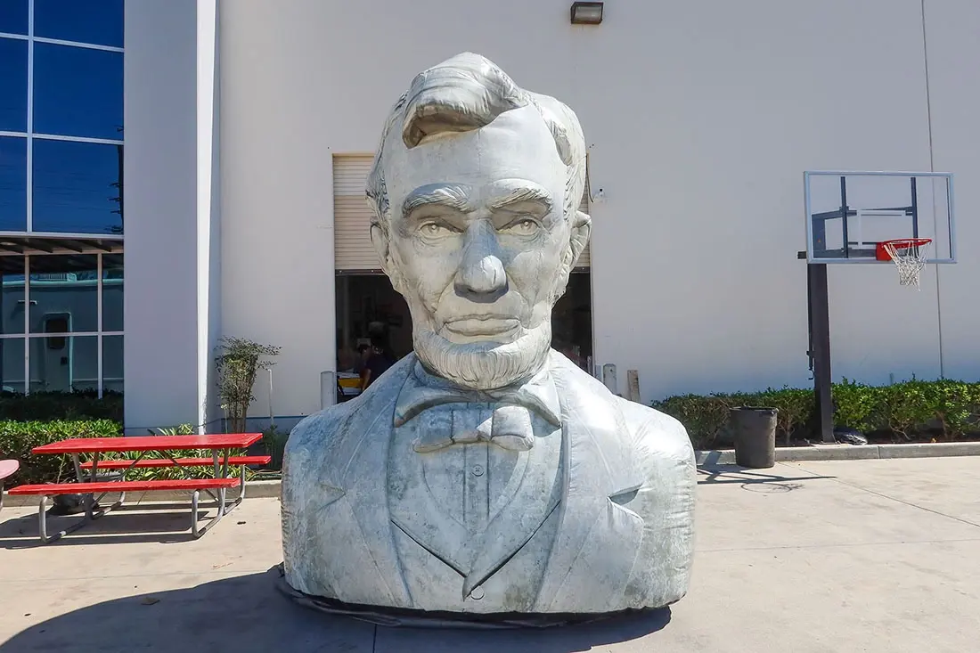 Front view of an inflatable Abraham Lincoln bust designed for branded events and displays Front view of an inflatable Abraham Lincoln bust designed for branded events and displays